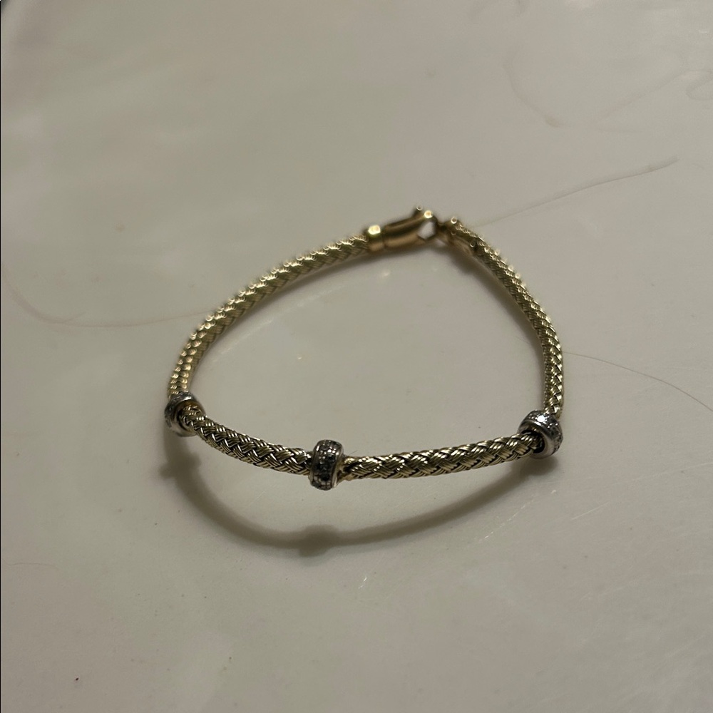 14 Kt yellow gold and white gold braided Women's Bracelet with diamonds